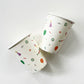 The Celebration paper party cups feature green, orange and blue balloons, ice cream cones, party hats, party garlands, birthday gifts and donuts.