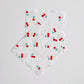 The paper party napkins feature a red, green and white cherry print.