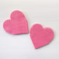 Bright pink heart shaped paper party napkins.