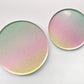 The Ombre Party Kit's large and small circular pink, yellow, green and gold paper party plates.