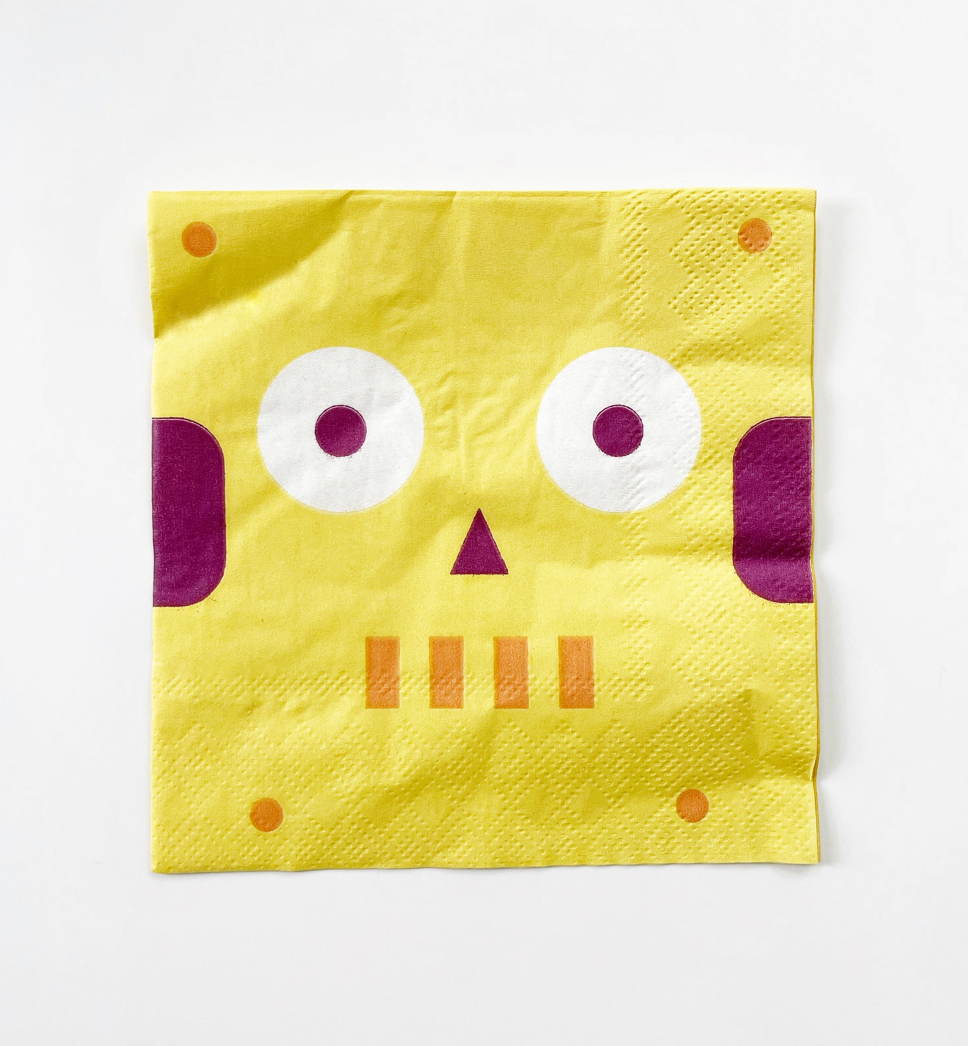 The paper party cocktail napkins feature a robot design in yellow, red and white.